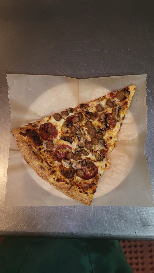 Meat Lovers Pizza Slice.